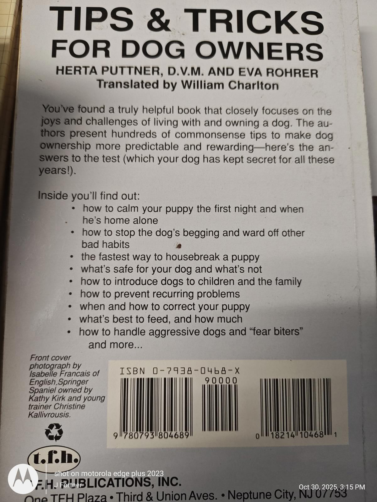 Tips and Tricks for Dog Owners book cover featuring helpful advice for new dog owners.