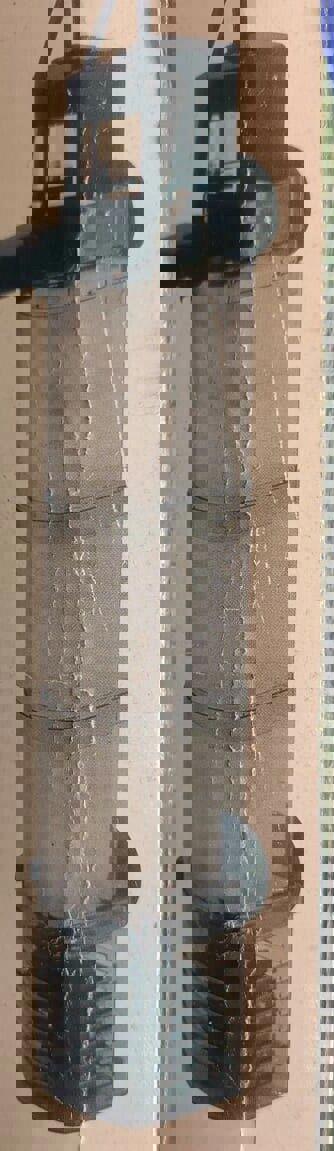 Product name not provided. Vertical filter with mesh design for efficient water filtration.