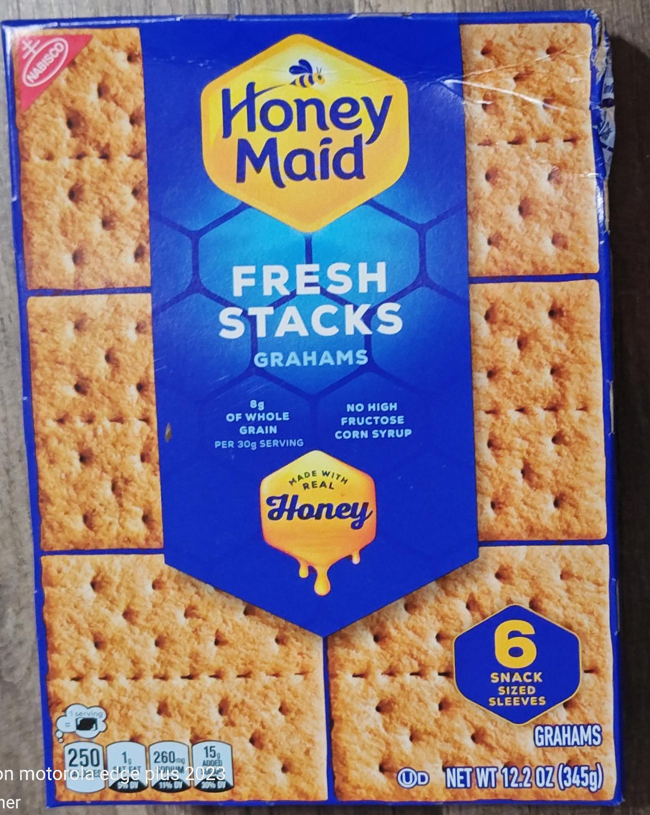 Honey Maid Fresh Stacks graham crackers in a blue box with honey graphics and 6 snack-sized sleeves.