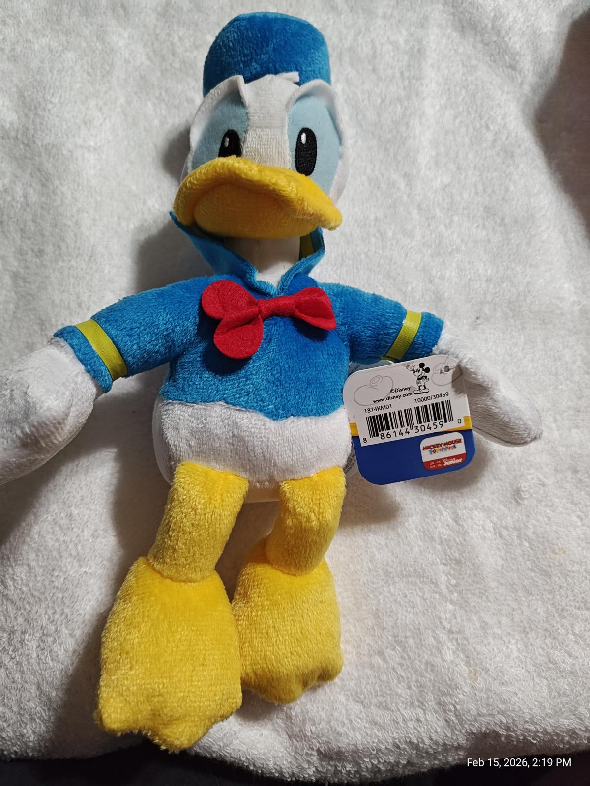 Donald Duck plush toy with blue outfit and red bow tie, perfect for collectors.