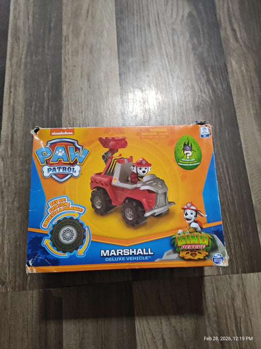 Paw Patrol Marshall deluxe vehicle featuring a red fire truck design with character figurine.