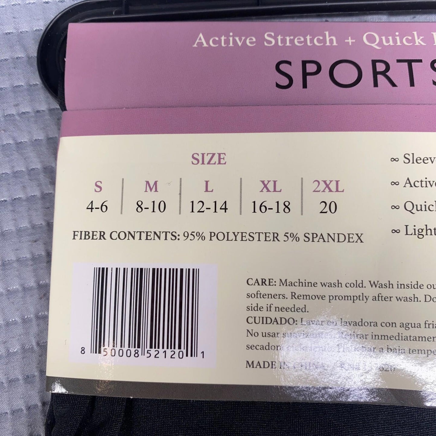Active Stretch Quick Dry Sportswear tag showing size options and fabric content.