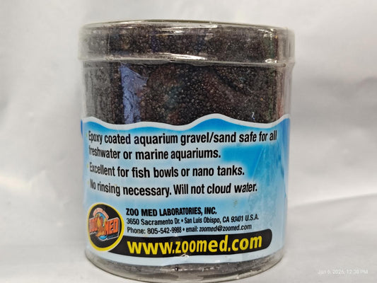 Zoo Med aquarium gravel in a clear container, suitable for freshwater and marine aquariums.