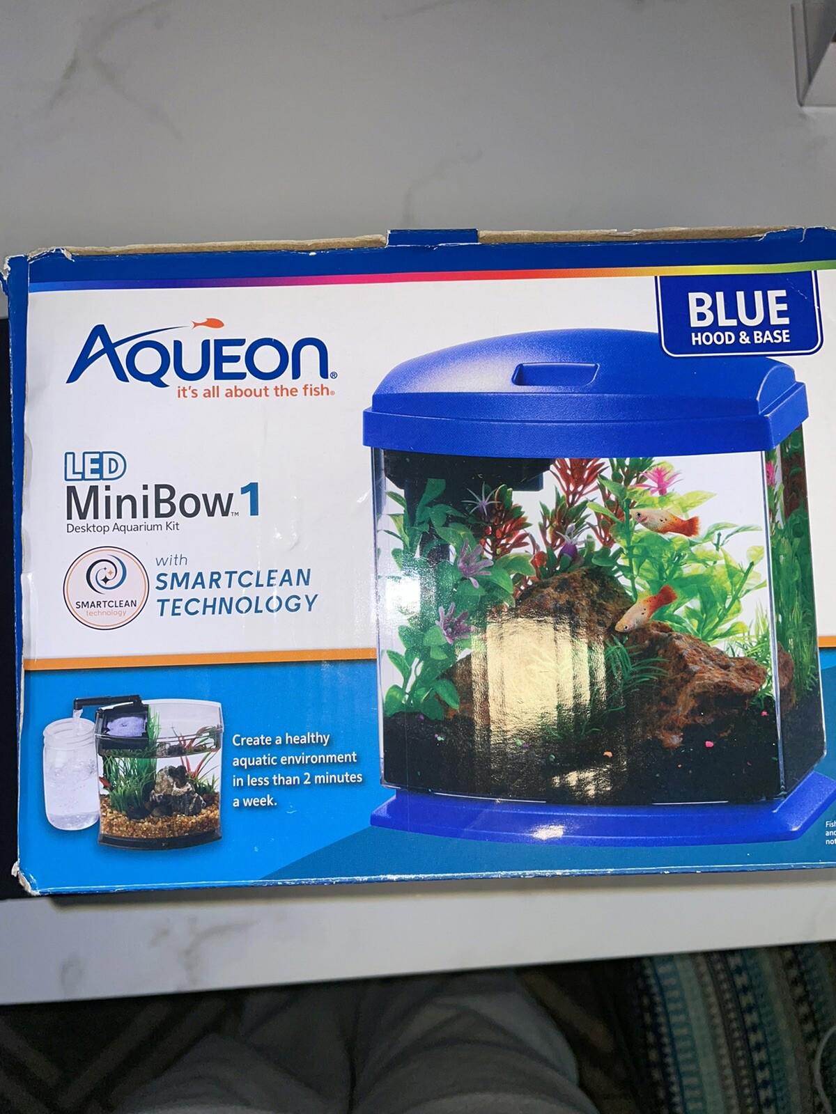 Aqueon MiniBow1 LED aquarium in blue with SmartClean technology, showcasing vibrant aquatic plants and fish.