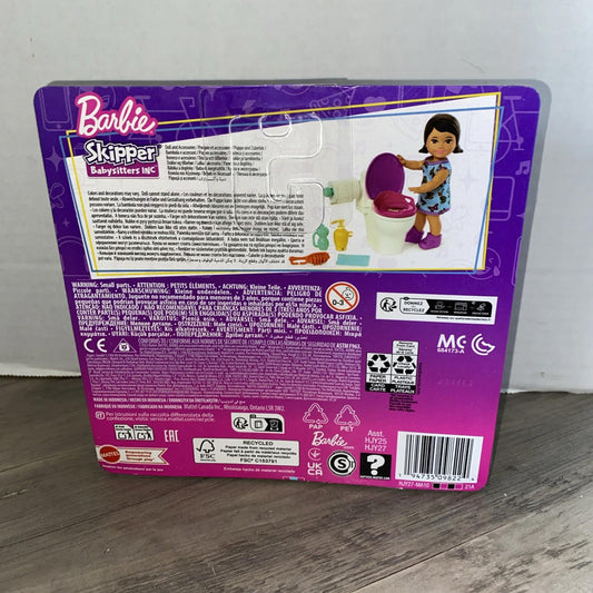 Barbie Skipper babysitters set featuring a doll with a toilet and cleaning supplies.