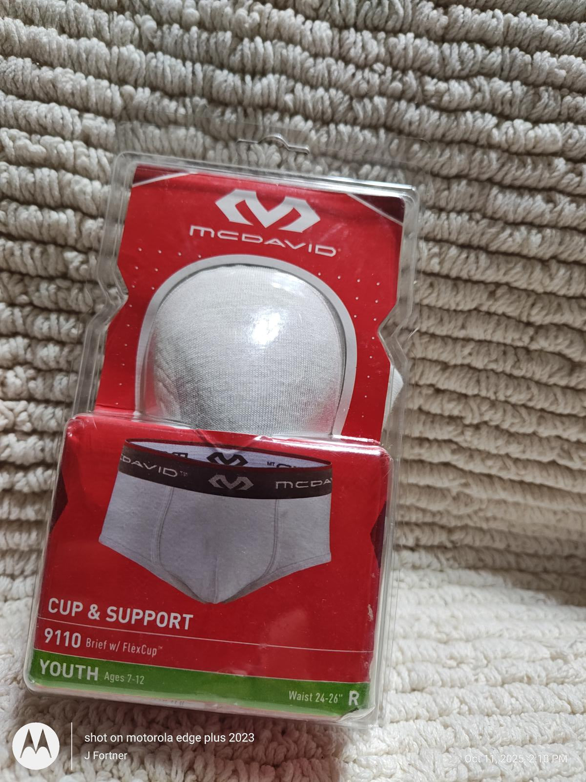 McDavid Cup & Support 9110 youth athletic supporter with white cup and red packaging.