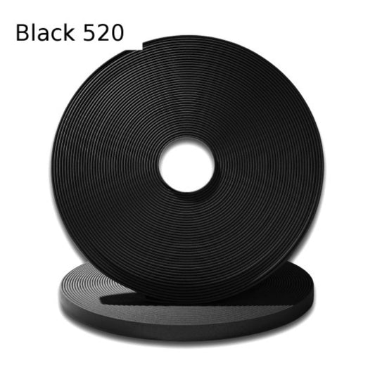 Black 520 roll featuring a smooth, textured surface ideal for various applications.