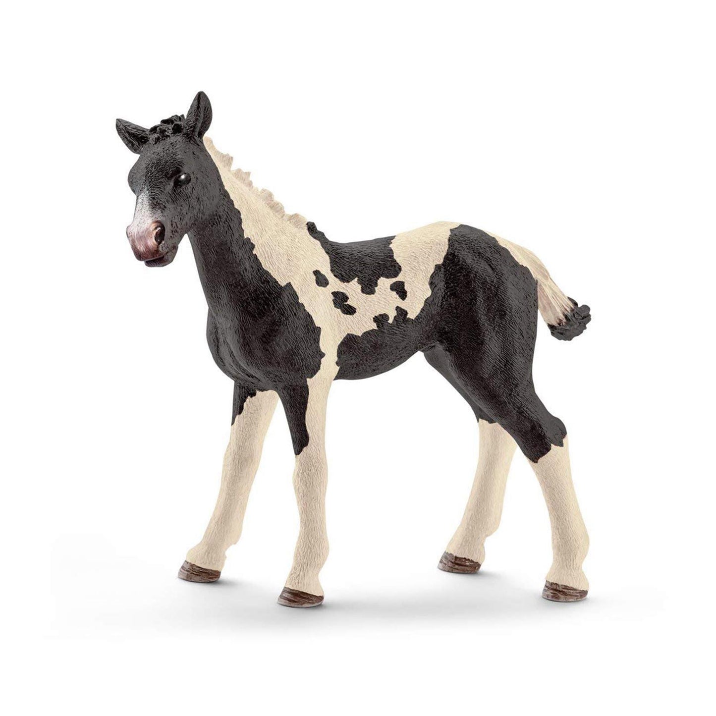 Black and white pony figurine with detailed features and realistic design.