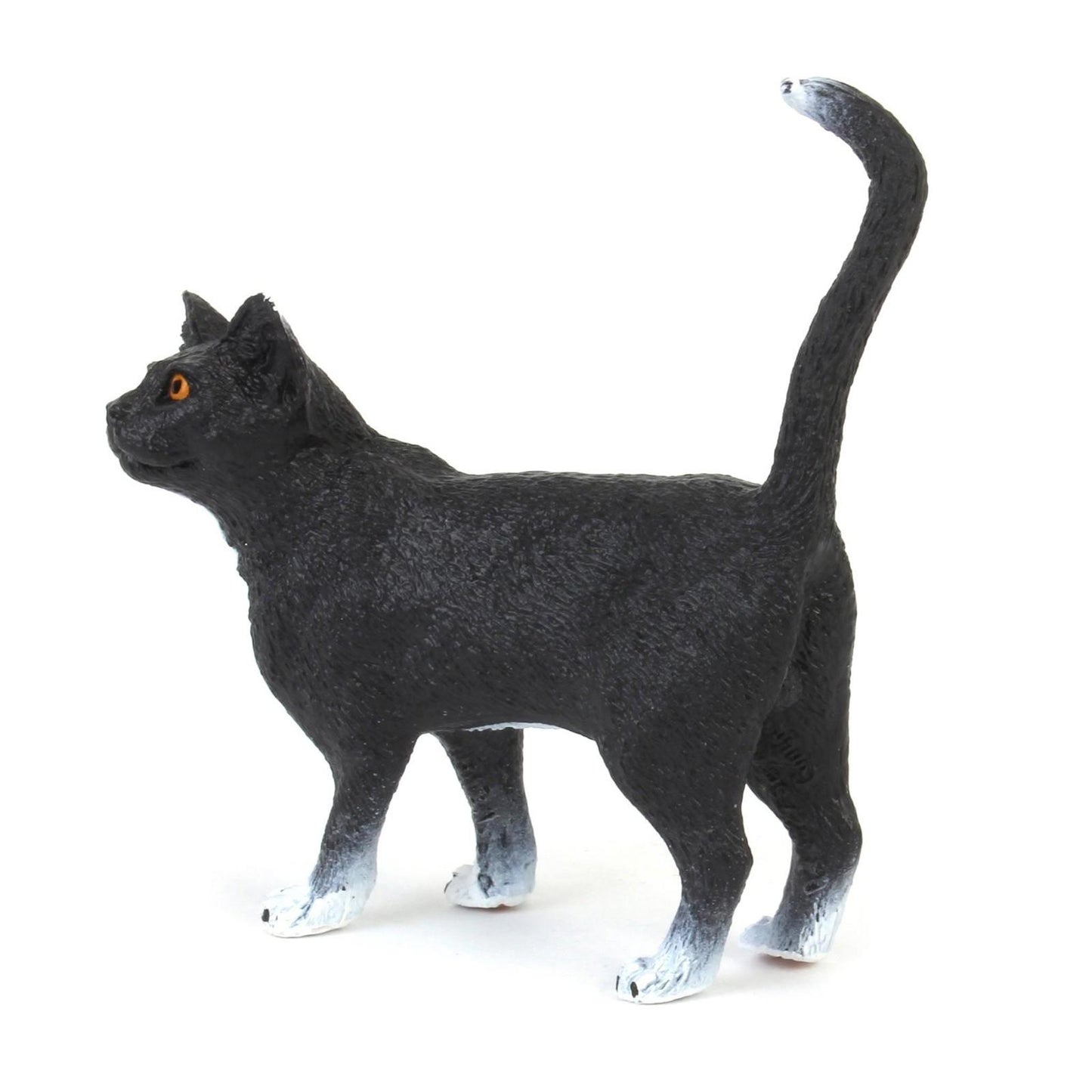 Black Cat Figurine with white paws and bright orange eyes.