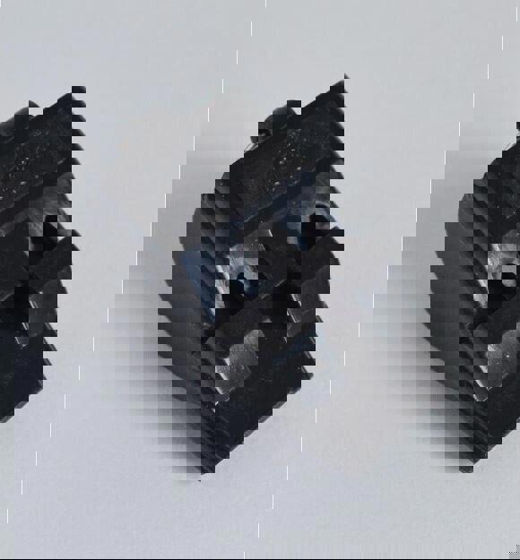 Black rubber shoe horn designed for easy shoe fitting.