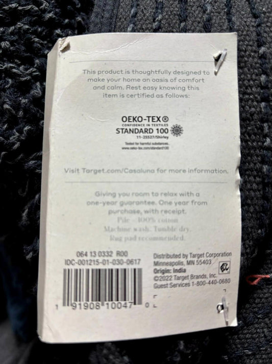 Casaluna throw blanket tag showing Oeko-Tex certification and care instructions.