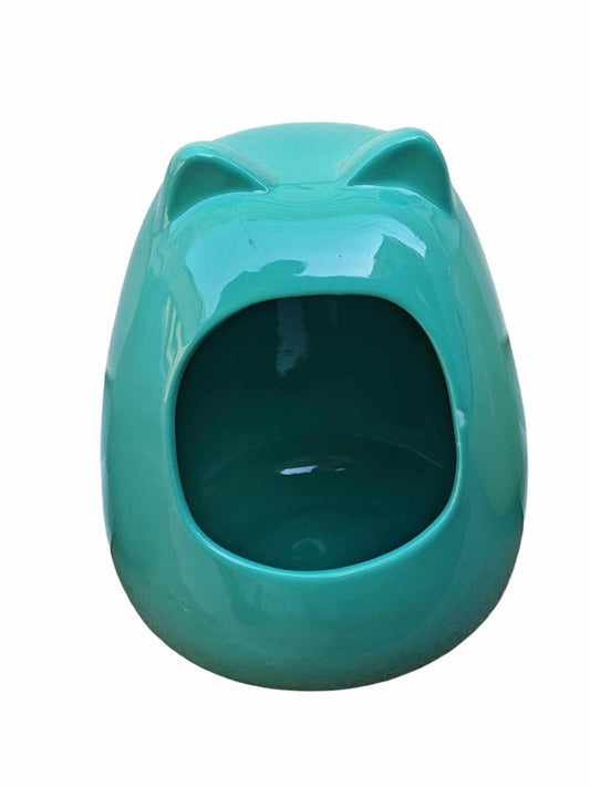 Cat cave bed in teal color with a playful design featuring cat ears.