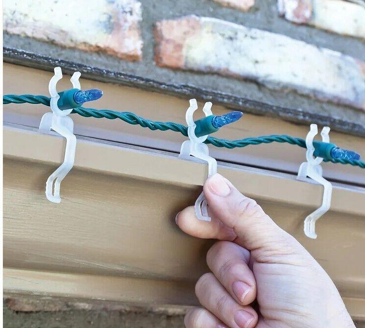Christmas Light Clips for easy installation on gutters, featuring durable plastic design.