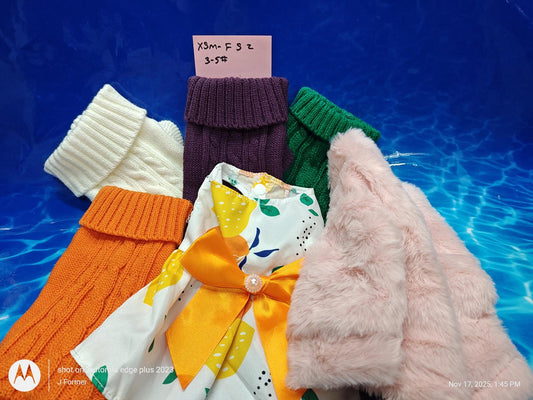 Colorful children's sweaters and dresses featuring a lemon print and a pink fur coat.