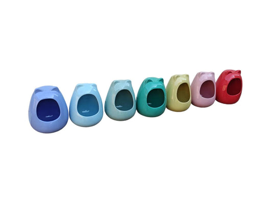 Colorful potty training seats in various pastel shades for toddlers.