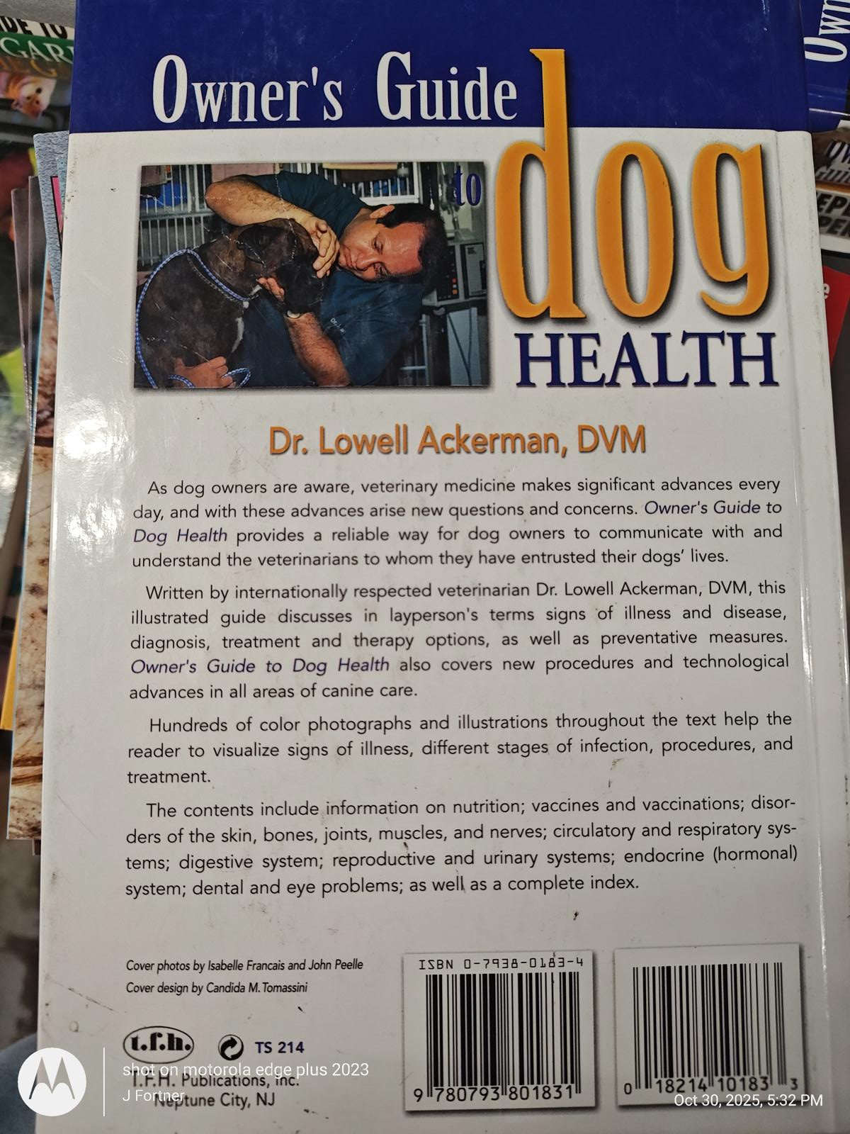 Dog Health owner's guide by Dr. Lowell Ackerman, featuring veterinary advice and illustrations.