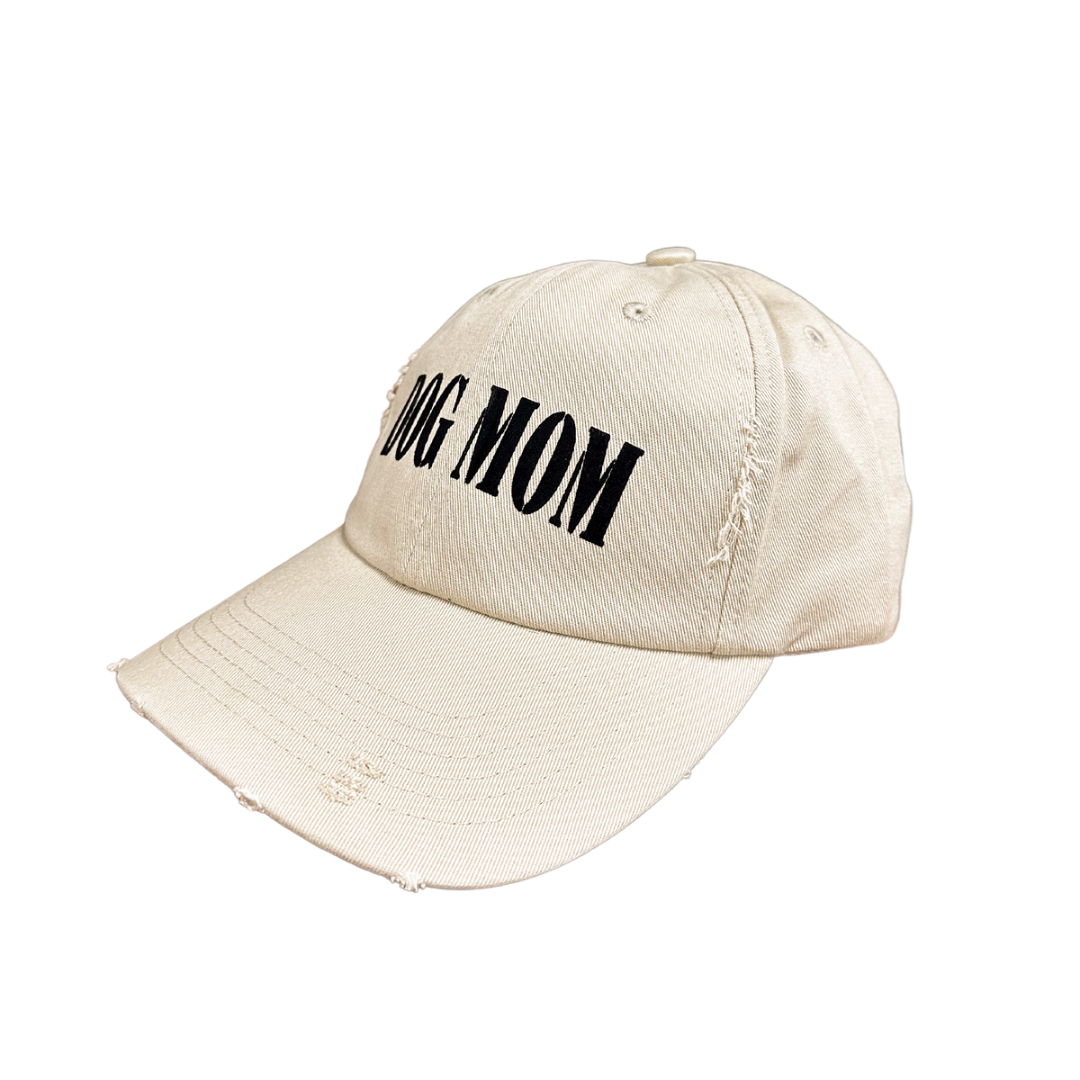 Dog Mom cap featuring a distressed design and bold black lettering.