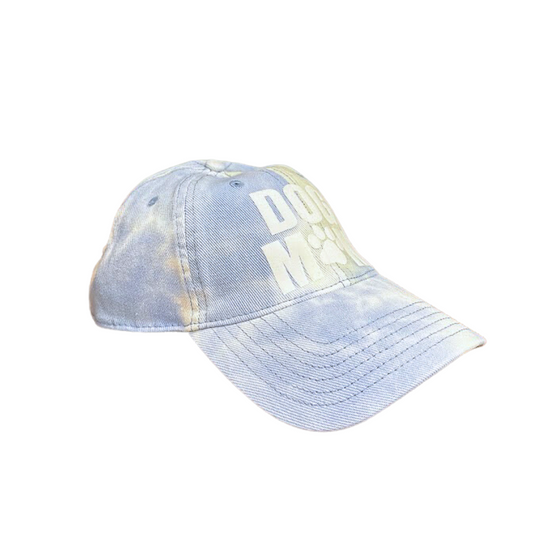 Dog Mom tie-dye cap featuring a paw print design in light blue.