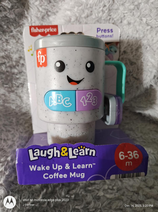 Fisher-Price Laugh & Learn coffee mug with smiling face, teaching letters and numbers for ages 6-36 months.