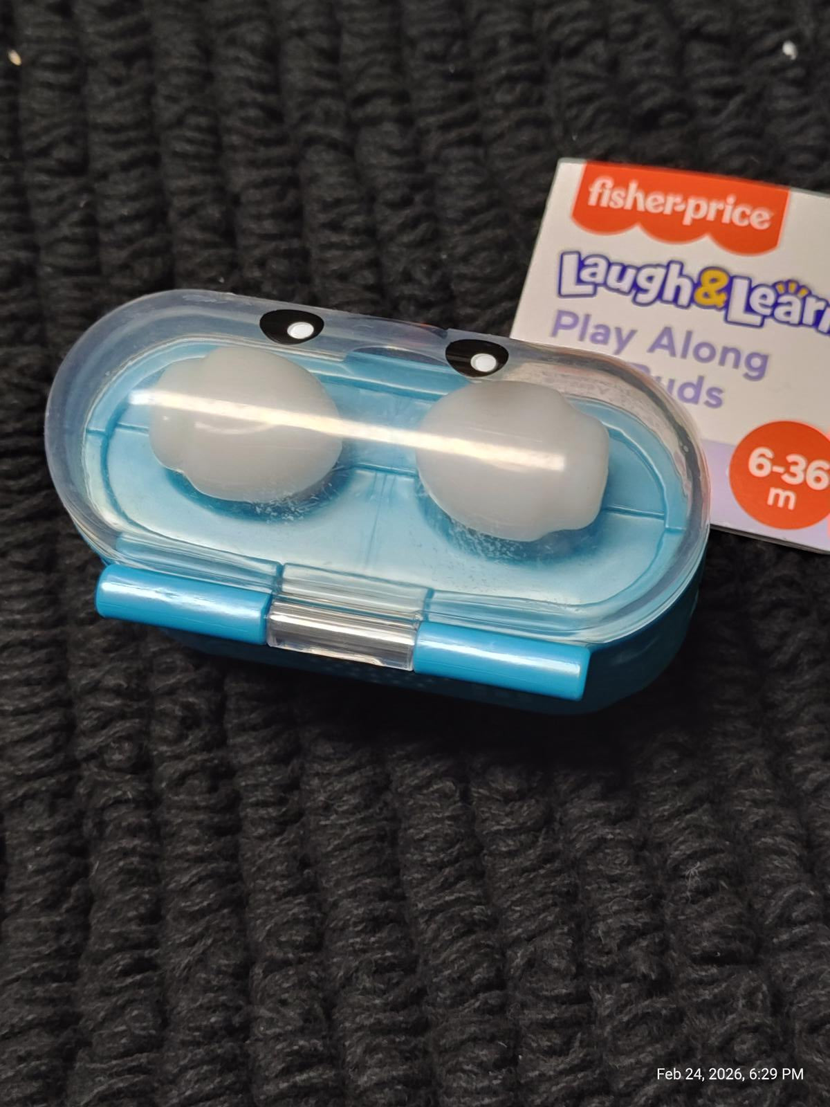 Fisher-Price Laugh & Learn Play Along earbuds in a blue case with playful design.
