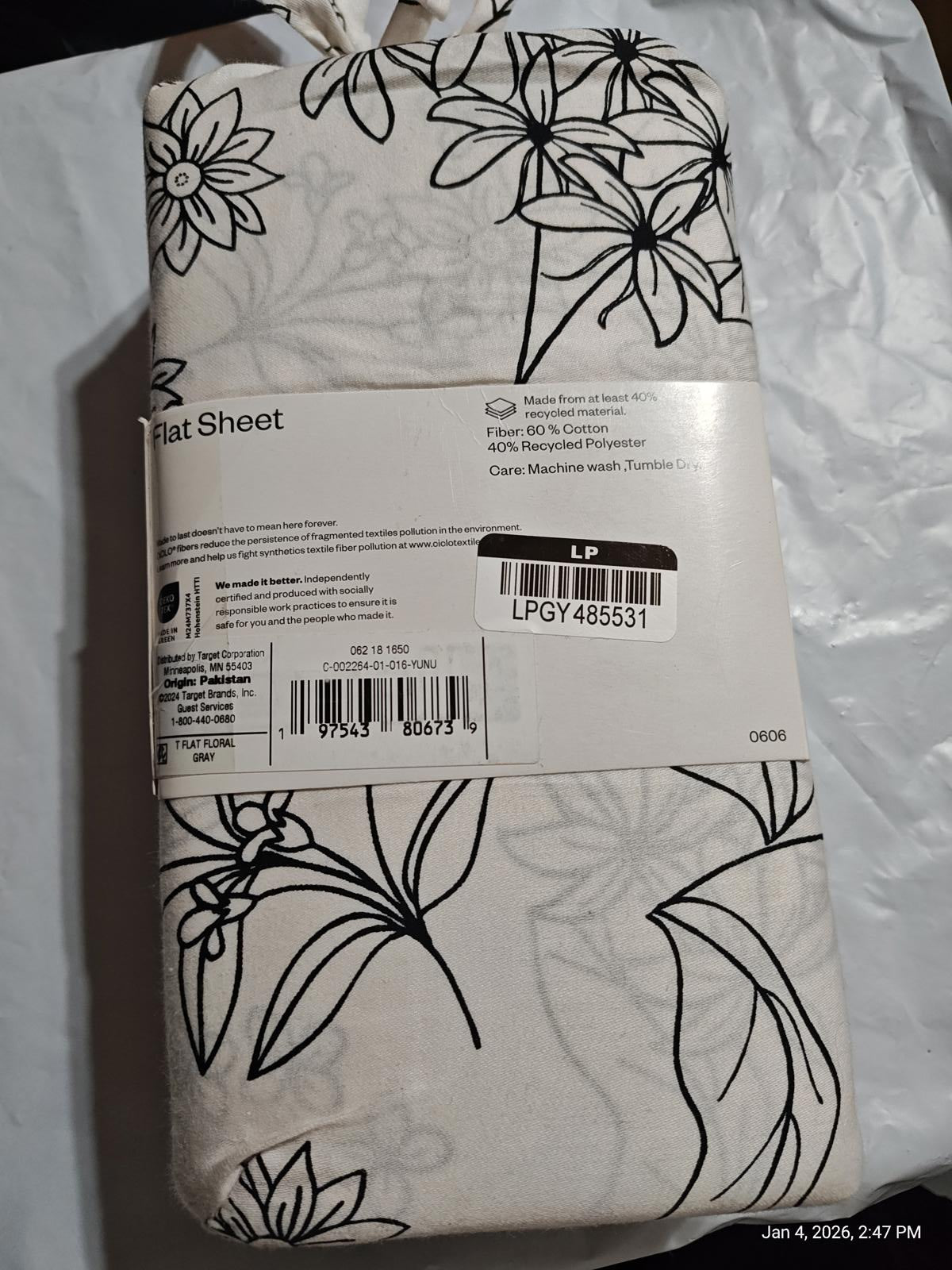 Flat sheet featuring a floral design in black and white, perfect for adding elegance to your bedding.