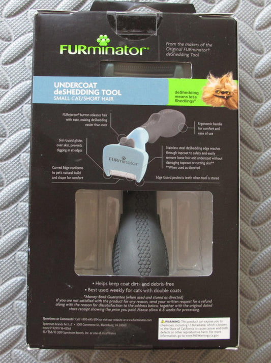 FURminator undercoat shedding tool for small cats with short hair, designed to reduce shedding.