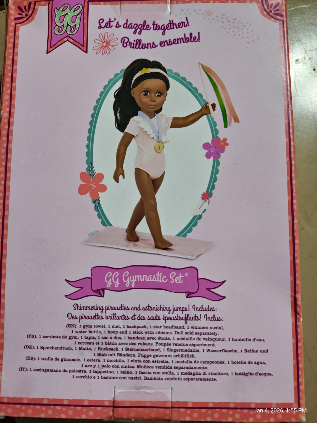 GG Gymnastic Set featuring a doll in a white outfit with a gold belt and colorful accessories.