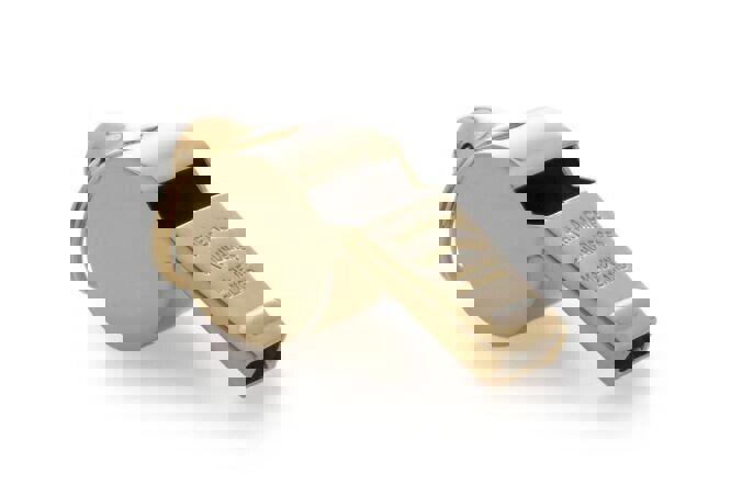 Gold referee whistle with keychain attachment for sports officiating.