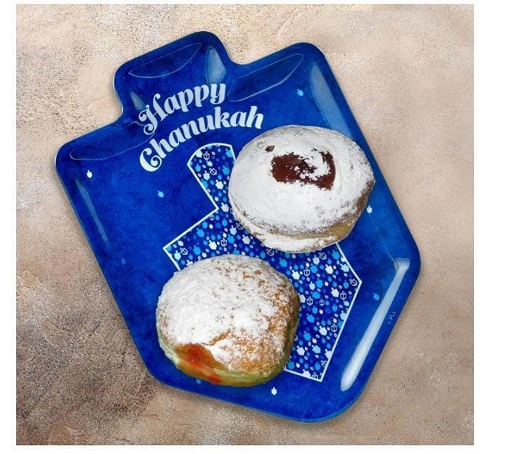 Happy Chanukah serving platter featuring two powdered jelly donuts.