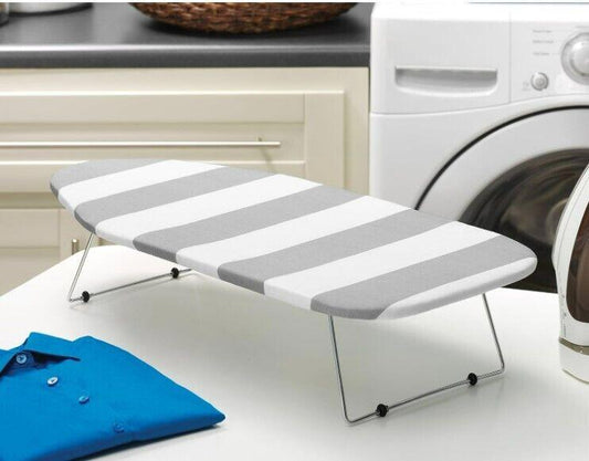 Ironing board cover with gray and white stripes, designed for compact ironing spaces.