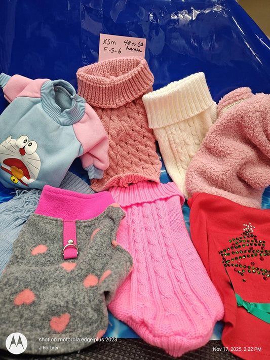 Ksm dog sweaters in various colors and textures, including pink, gray, and blue.
