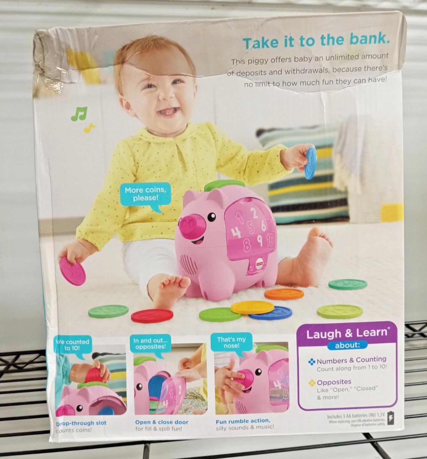 Laugh & Learn piggy bank toy with colorful coins for counting and music.