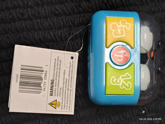 Learning Toy with colorful buttons and a clear casing for interactive play.