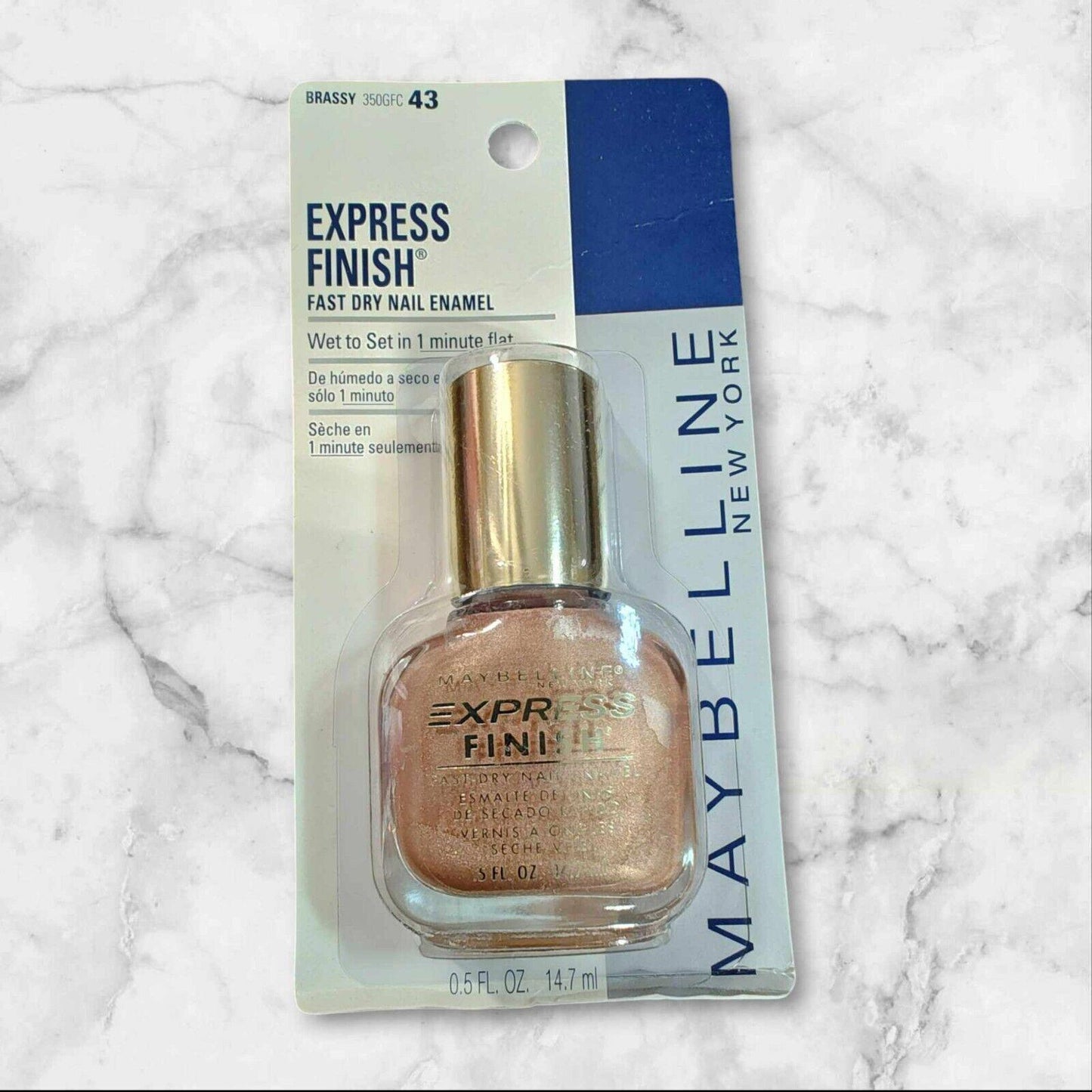 Maybelline Express Finish fast dry nail enamel in shade 43, featuring a metallic finish and sleek bottle design.