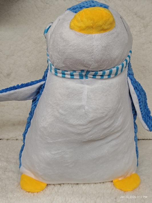 Penguin plush toy with blue and white colors and a striped scarf.