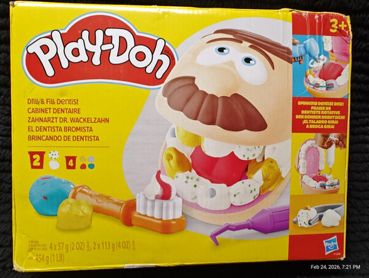 Play-Doh Dentist Set with colorful tools and a smiling character for creative play.