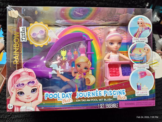 Pool Day playset featuring dolls, colorful accessories, and a fun pool theme.