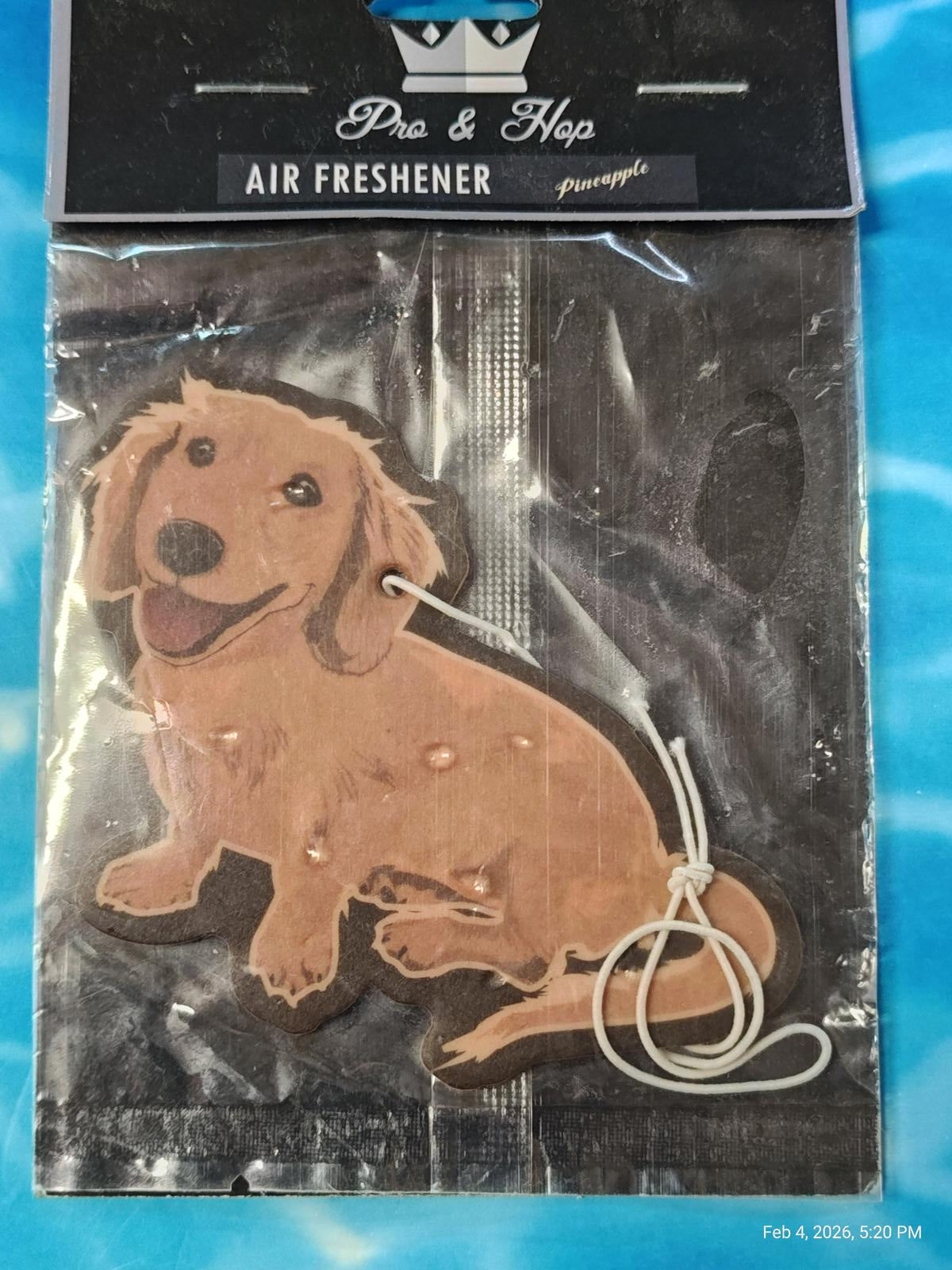 Pro & Hop air freshener featuring a cute golden retriever design with a smiling expression.