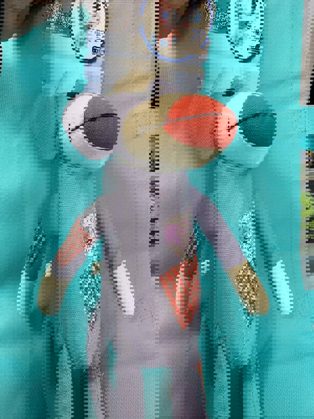 Sock Monkey Plush Toy with colorful patches and a playful design.