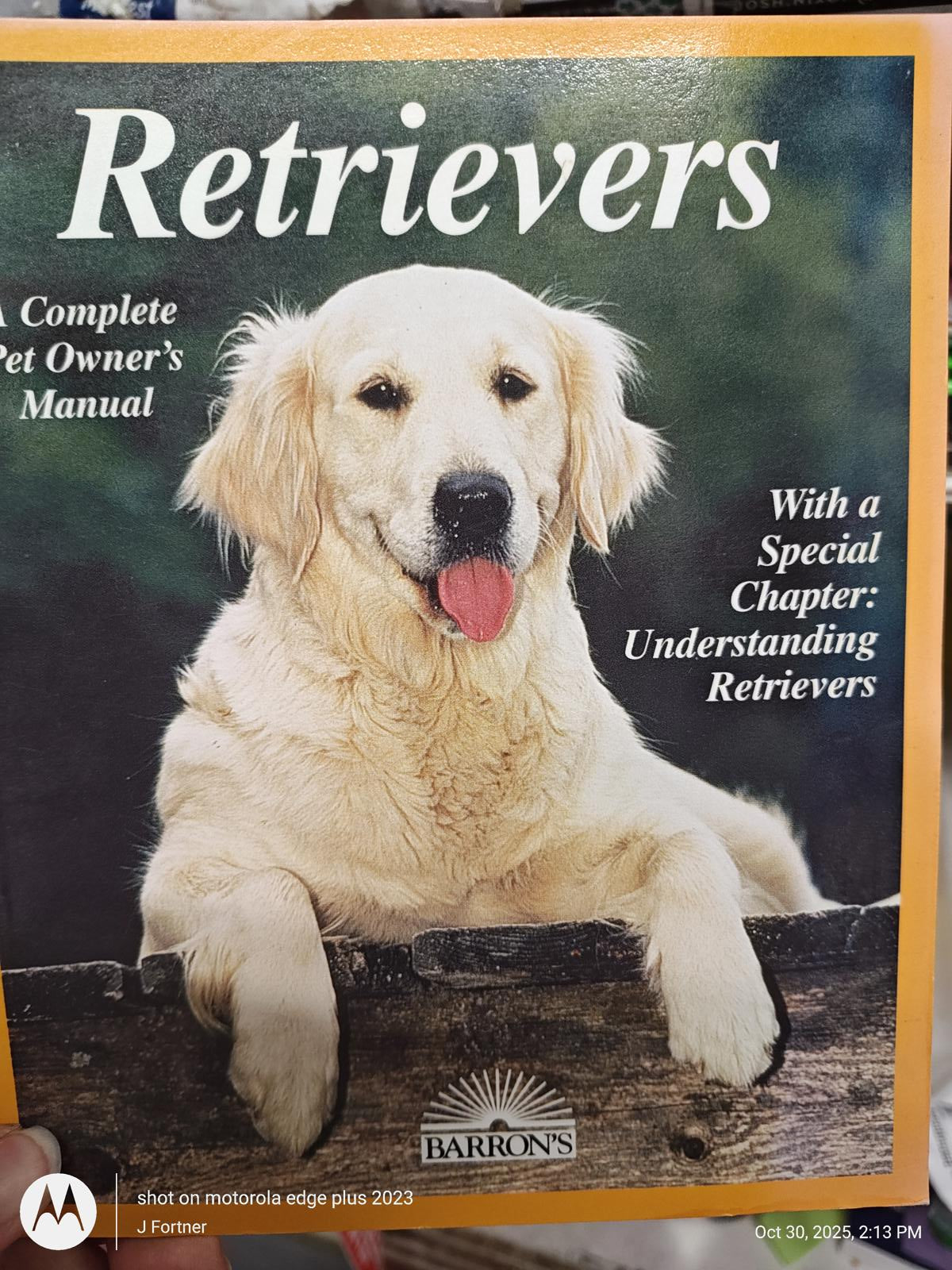 Retrievers book cover featuring a golden retriever, highlighting pet ownership tips.