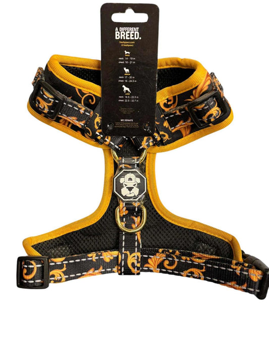 Skull and floral design dog harness featuring adjustable straps and a padded interior.
