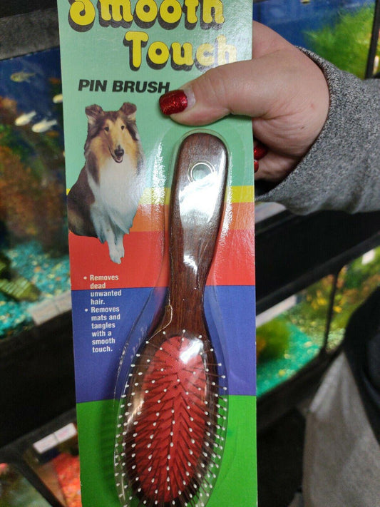 Smooth Touch pin brush with wooden handle and red bristles for grooming pets.