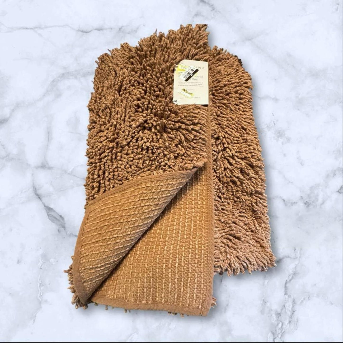 Soft Brown Bath Mat featuring plush shag texture and a smooth underside.