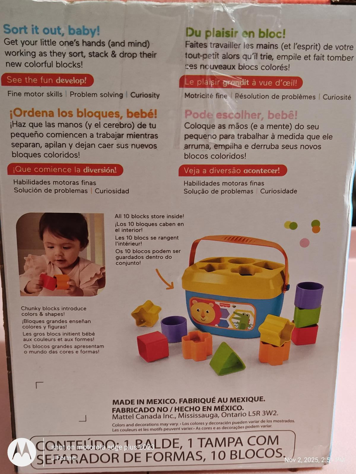 Sort it out, baby! colorful block sorting toy with various shapes and a child playing.