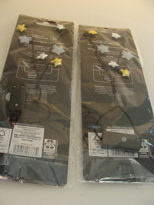 Star-themed party decorations featuring silver and gold stars on black string.