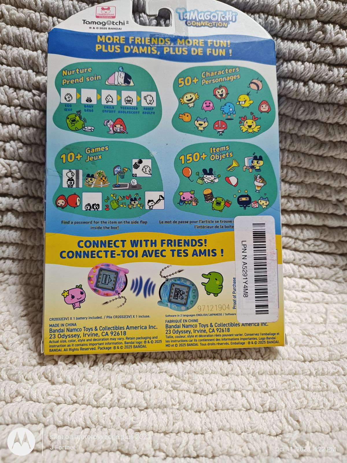 Tamagotchi Smart packaging featuring colorful characters and game features for interactive fun.
