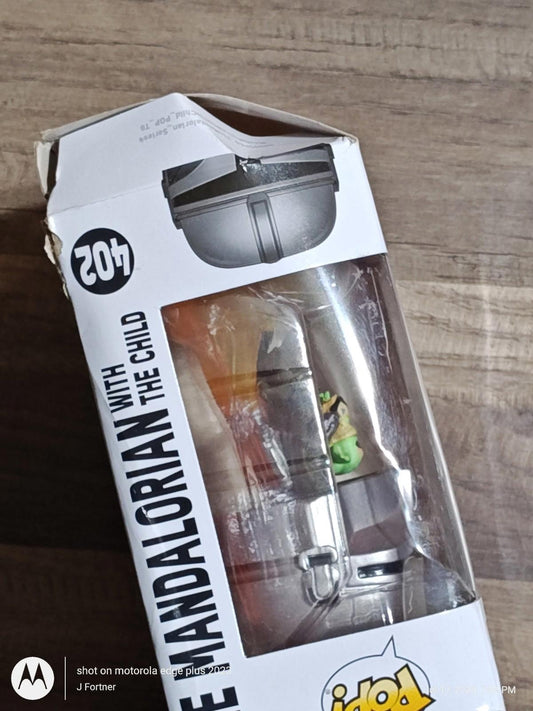 The Mandalorian with The Child action figure in packaging, showcasing detailed design.
