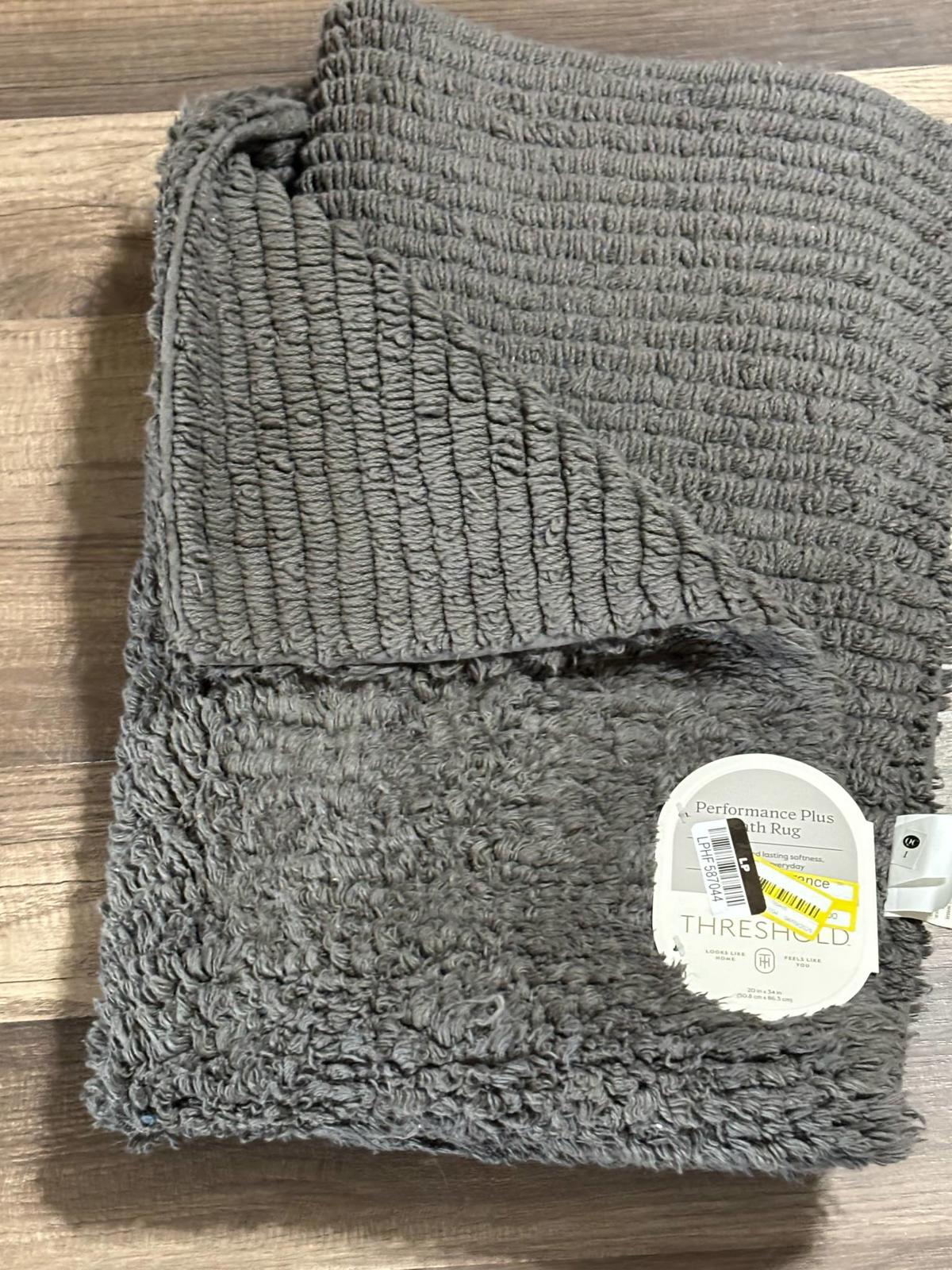 Thirsty Towel in gray color, featuring a soft, textured design for maximum absorbency.