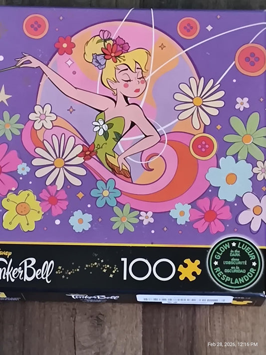 TinkerBell 100-piece puzzle featuring a colorful design with flowers and TinkerBell in a whimsical pose.
