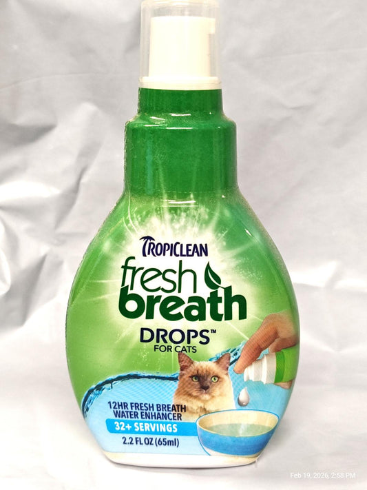 TropiClean Fresh Breath Drops for Cats, 12-hour fresh breath formula in a green bottle.